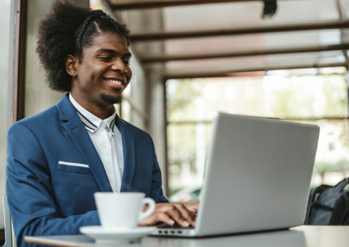 stylish african american businessman brokering business on LinkedIn