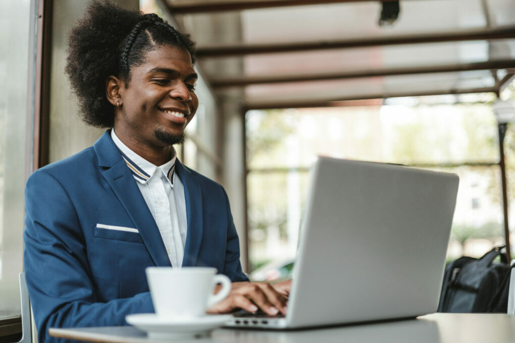 stylish african american businessman brokering business on LinkedIn